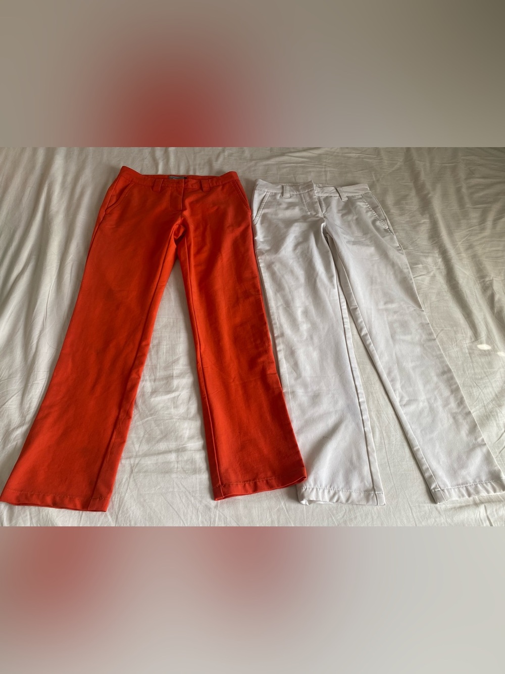 2 J. Lindeberg pants in white and orange, size 26/27